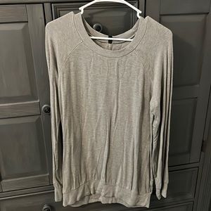 Woman’s grey, long sweater